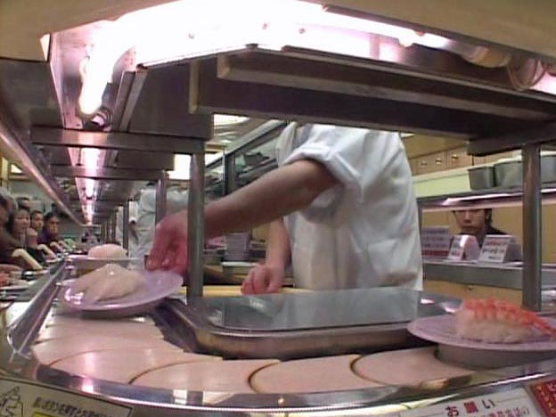 Putting sushi on a plate